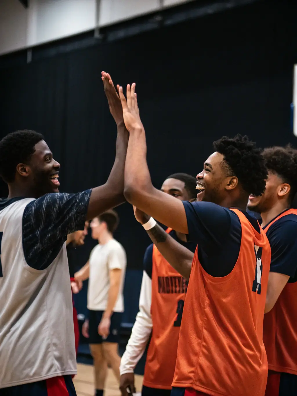 A group photo of ASS TASDON BASKET coaches and players, smiling and celebrating their shared passion for basketball and the community they've built together.